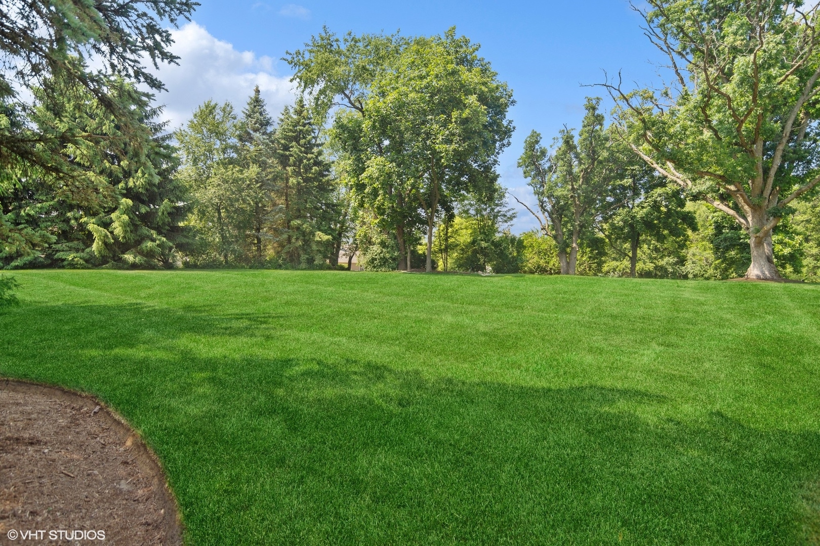716 Saddle Ridge Crystal Lake, IL 60012 - Photo 34 of 42 a view of a grassy field with trees