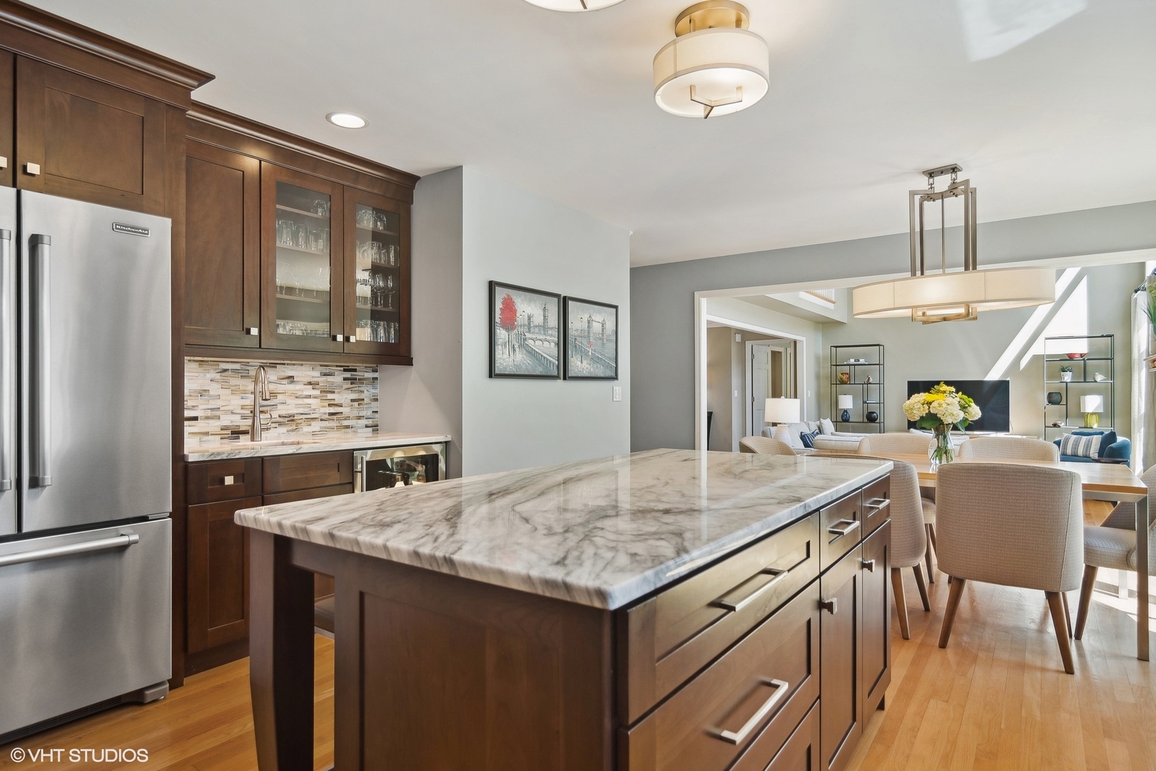 716 Saddle Ridge Crystal Lake, IL 60012 - Photo 5 of 42 a kitchen with a table chairs refrigerator and microwave