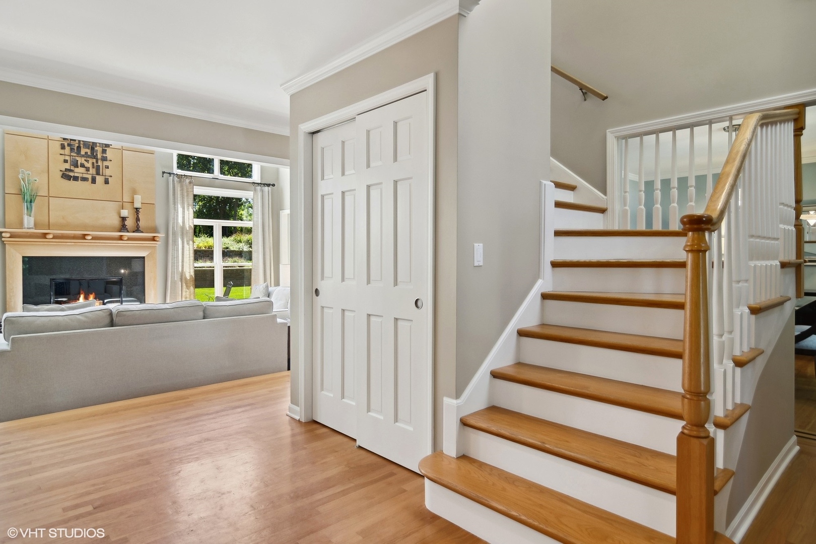 716 Saddle Ridge Crystal Lake, IL 60012 - Photo 6 of 42 a view of an entryway with wooden floor and a front door