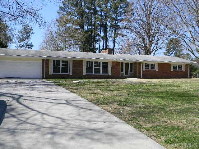 2705 Trawick Road Raleigh, NC 27604 - Photo 1 of 9 front view of a house with a garden