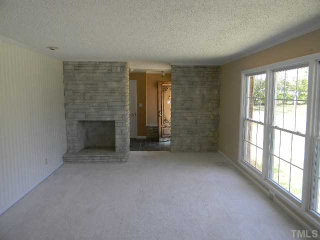 2705 Trawick Road Raleigh, NC 27604 - Photo 4 of 9 an empty room with windows
