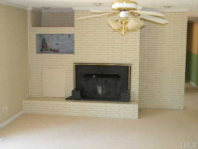 2705 Trawick Road Raleigh, NC 27604 - Photo 5 of 9 a building with a fireplace