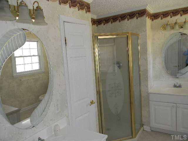 2705 Trawick Road Raleigh, NC 27604 - Photo 7 of 9 a bathroom with a shower and a sink