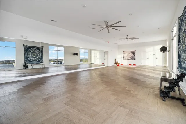 a very nice looking room with a ceiling fan