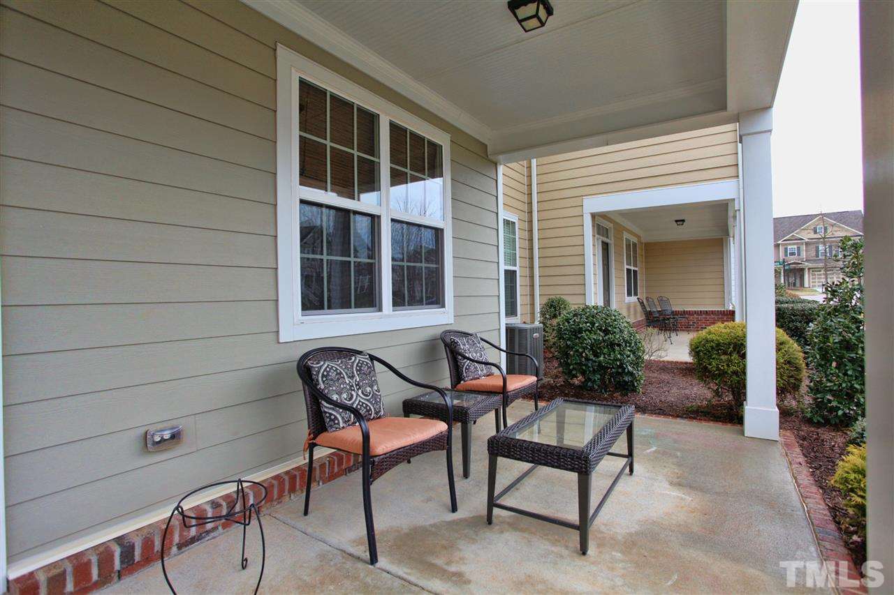 618 Democracy Street Raleigh, NC 27603 - Photo 2 of 24 a view of house with outdoor seating and deck