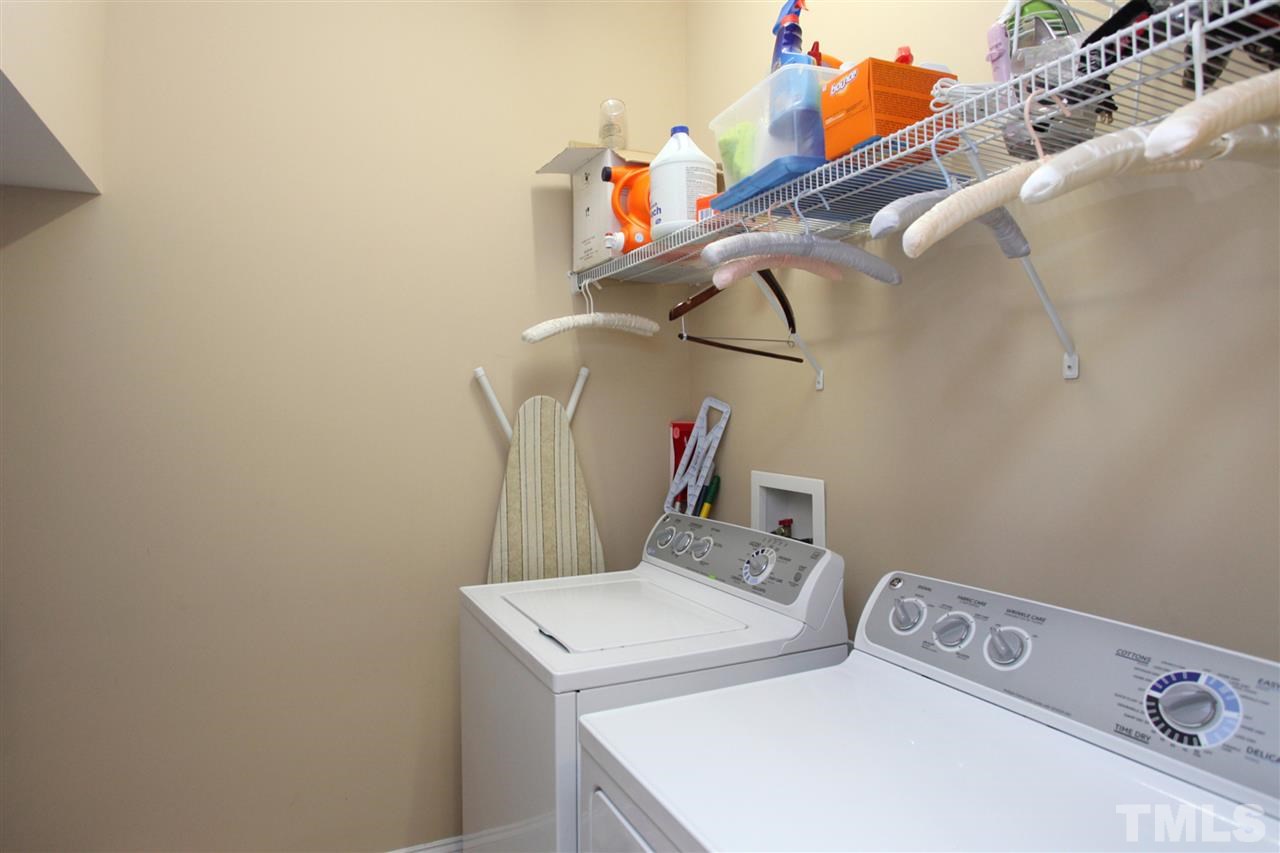 618 Democracy Street Raleigh, NC 27603 - Photo 11 of 24 a utility room with dryer and washer