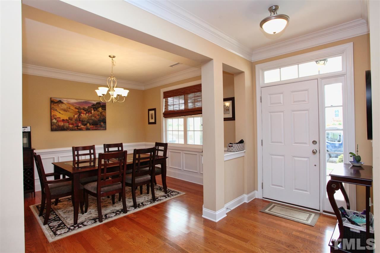 618 Democracy Street Raleigh, NC 27603 - Photo 24 of 24 a view of a dining room with furniture and wooden floor