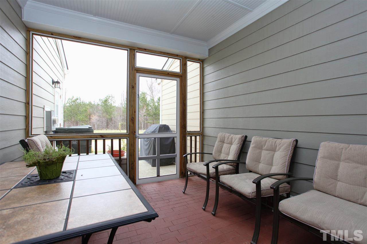618 Democracy Street Raleigh, NC 27603 - Photo 20 of 24 a balcony with furniture and a potted plant