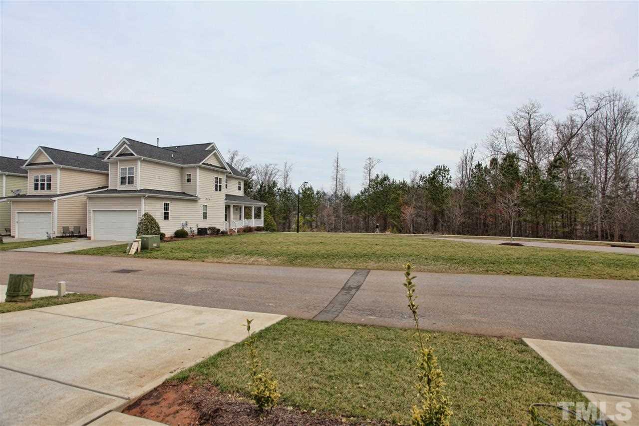618 Democracy Street Raleigh, NC 27603 - Photo 21 of 24 a view of a house with a yard