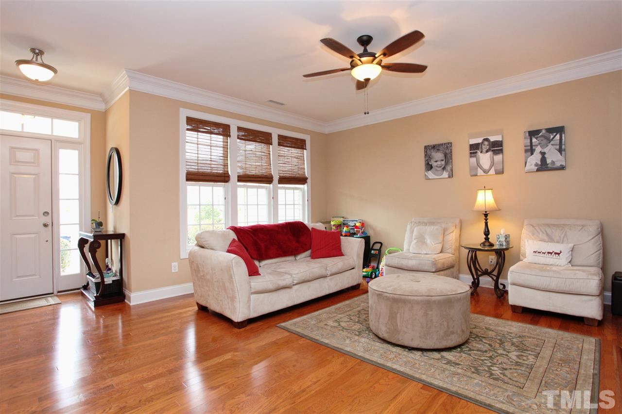 618 Democracy Street Raleigh, NC 27603 - Photo 5 of 24 a living room with furniture and a large window