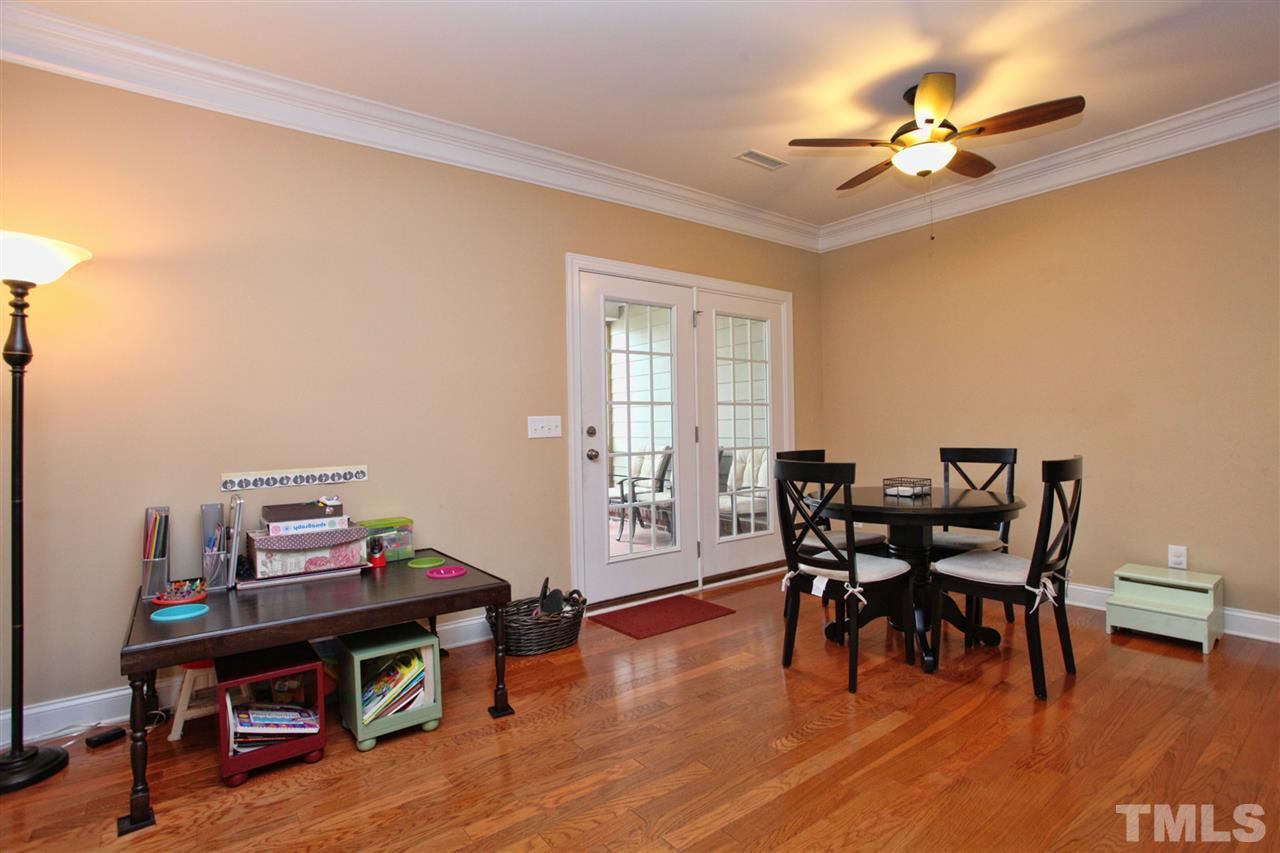 618 Democracy Street Raleigh, NC 27603 - Photo 9 of 24 a view of a workspace with furniture and wooden floor
