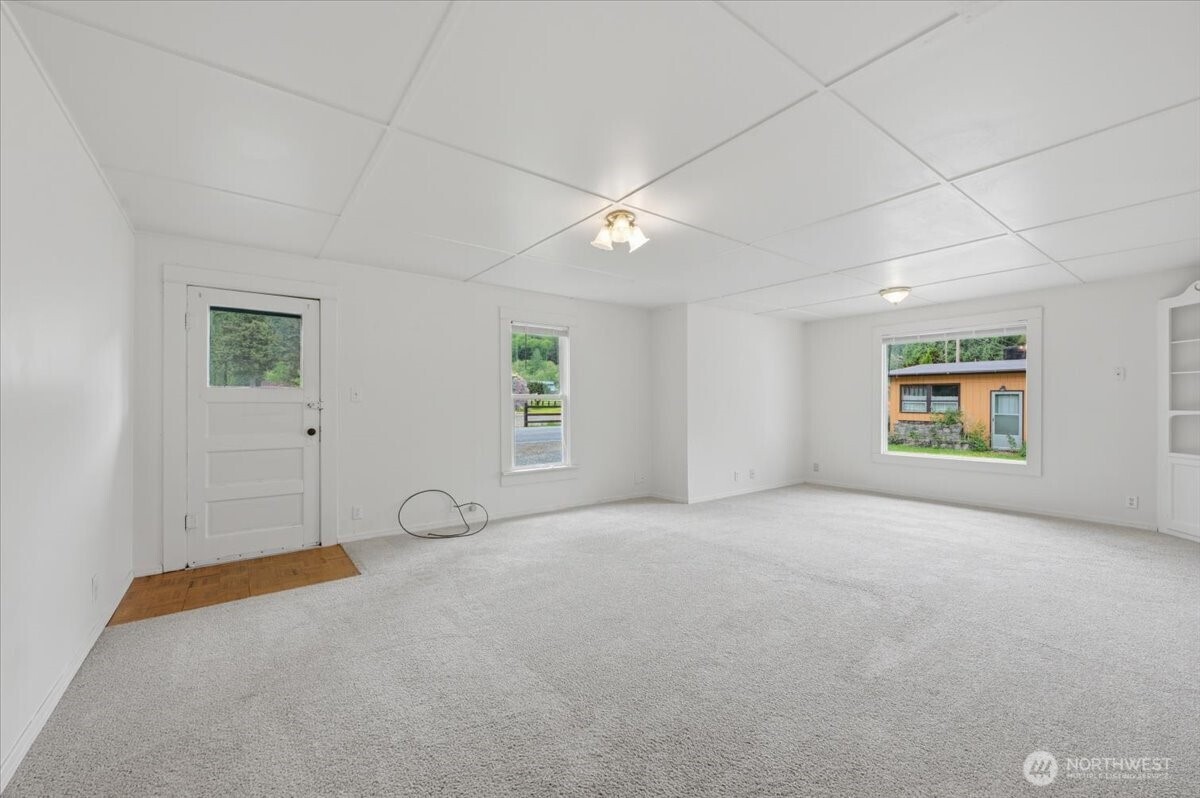 23746 Old Day Creek Road, Unit A & B Sedro-Woolley, WA 98284 - Photo 8 of 36 an empty room with windows and fan