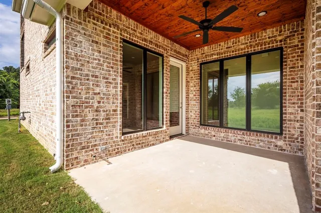 a view of a brick house with a large window