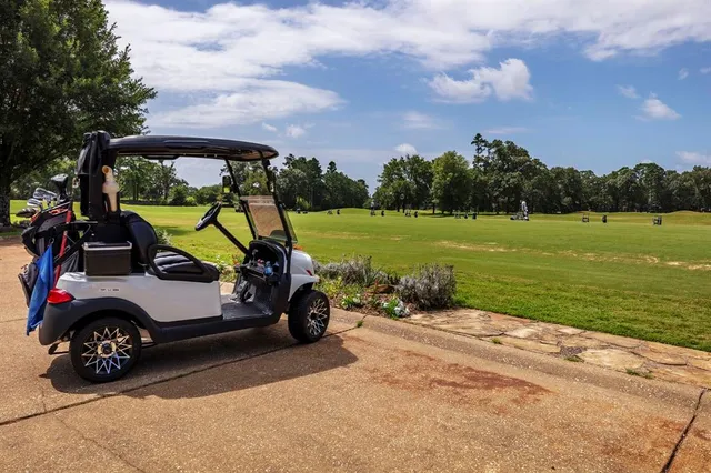a view of a car park side of the road