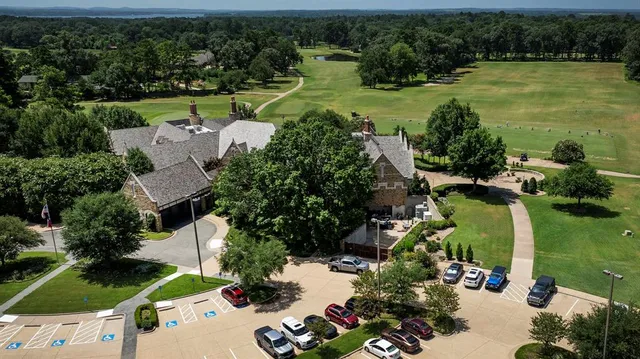 an aerial view of house with yard swimming pool and outdoor seating