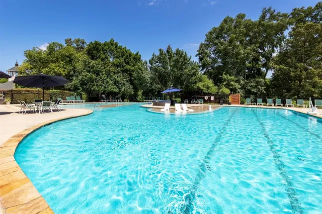 a view of a swimming pool with an outdoor space