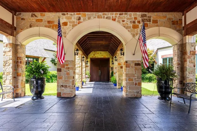 a living room with lots of furniture and a clock