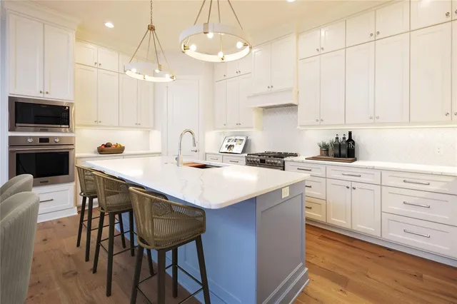a kitchen with a sink cabinets and window