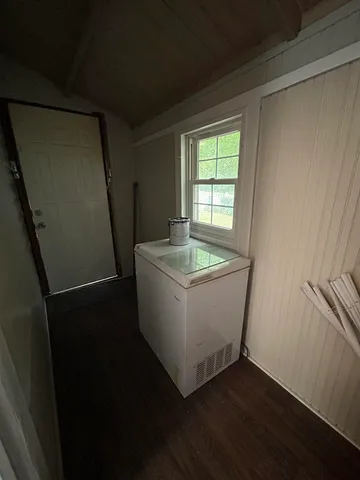 a room with window and wooden floor