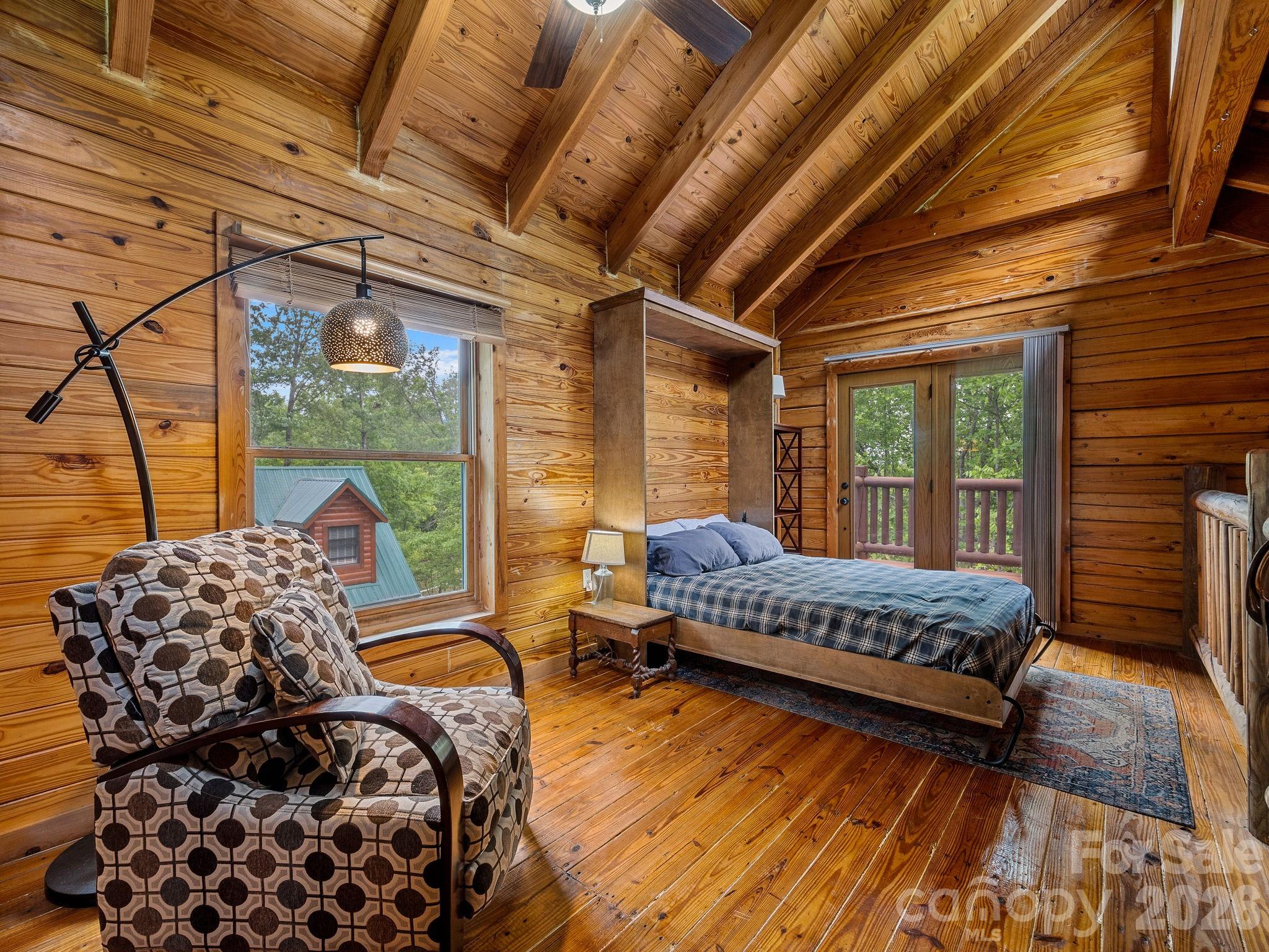 270 Cross Ridge Drive Rutherfordton, NC 28139 - Photo 15 of 38 a bedroom with furniture and a large window