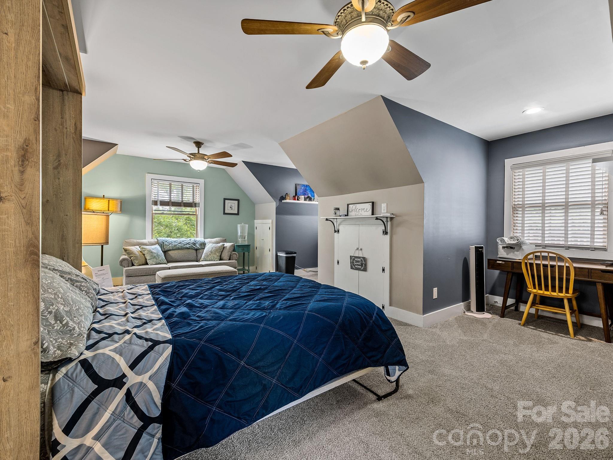 270 Cross Ridge Drive Rutherfordton, NC 28139 - Photo 27 of 38 a bedroom with a bed and a chandelier