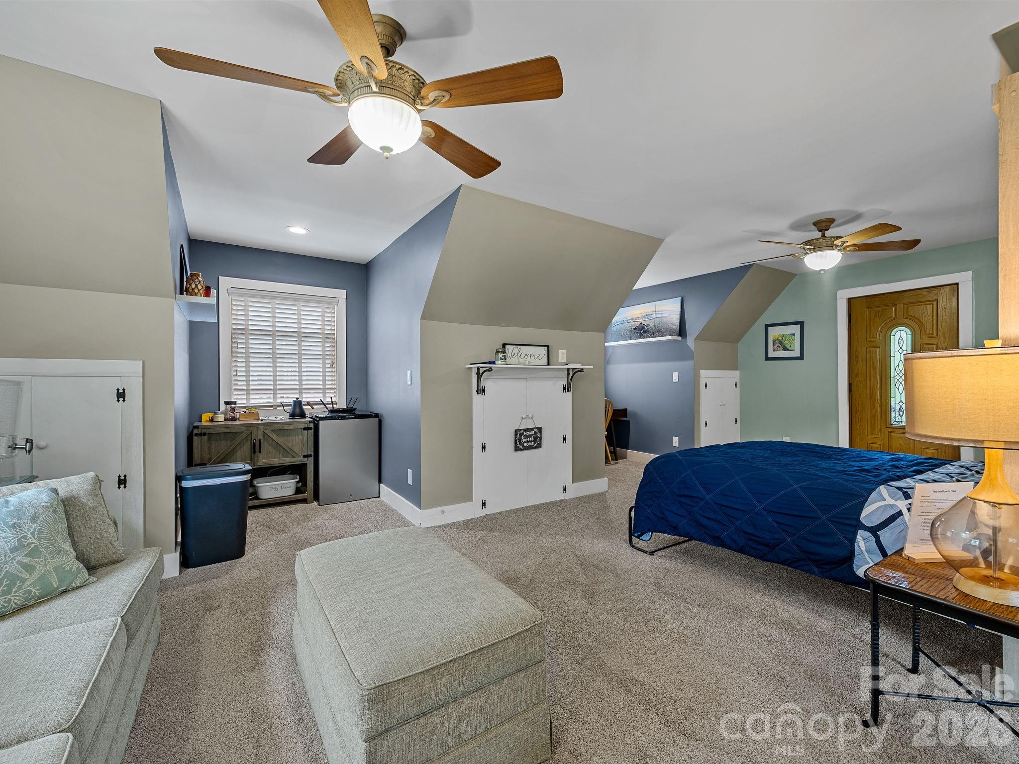 270 Cross Ridge Drive Rutherfordton, NC 28139 - Photo 30 of 38 a spacious bedroom with a bed and a chandelier