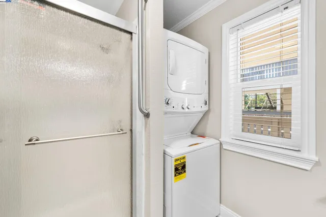 a utility room with a window dryer and washer