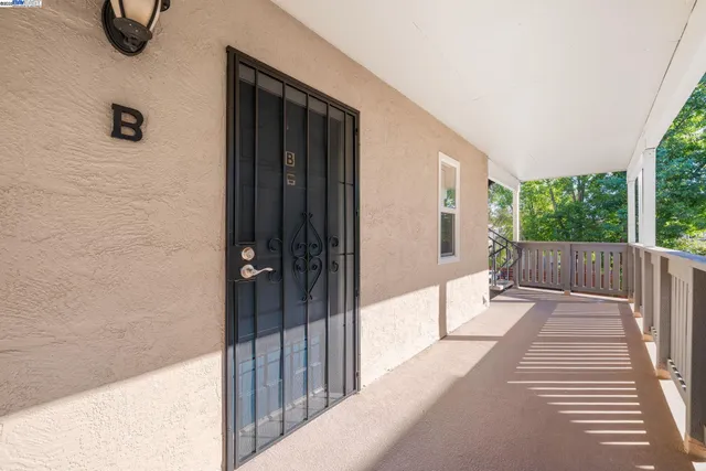 a view of a building with car parked