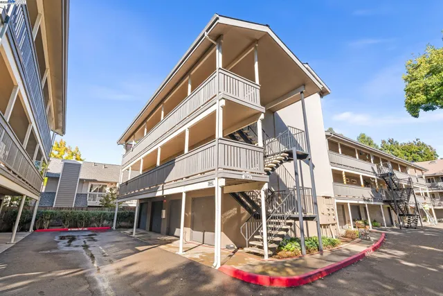 a view of a building with sitting area