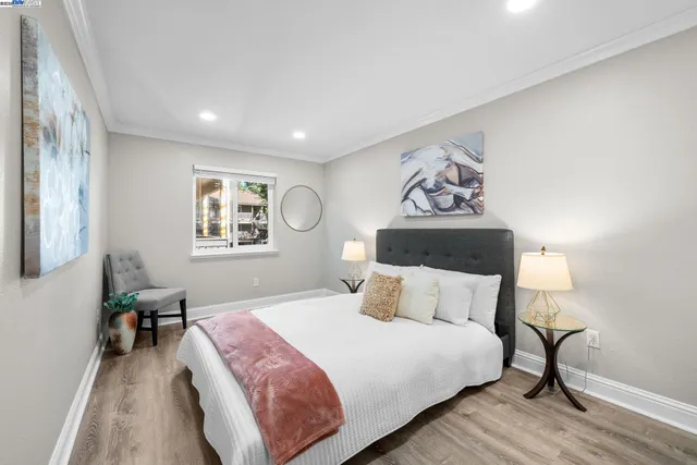 a bedroom with a large bed and a window