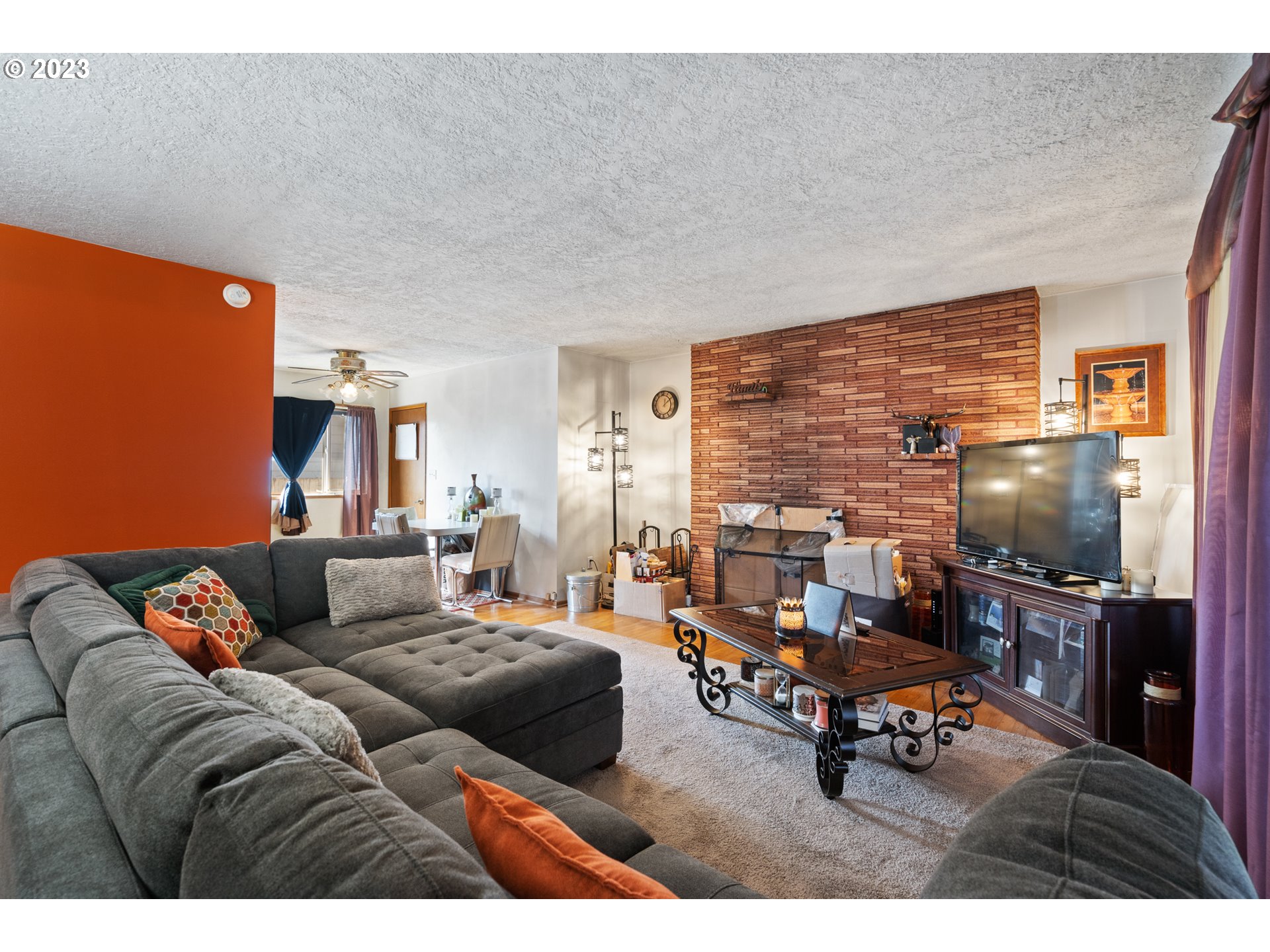 3832 North Kilpatrick Street Portland, OR 97217 - Photo 16 of 34 a living room with furniture and a flat screen tv