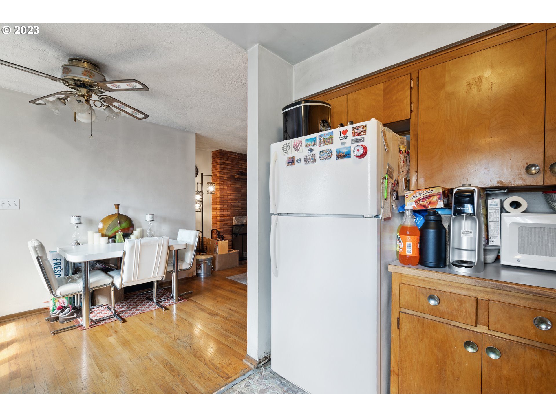 3832 North Kilpatrick Street Portland, OR 97217 - Photo 22 of 34 a kitchen with stainless steel appliances a refrigerator a sink a counter top space and cabinets