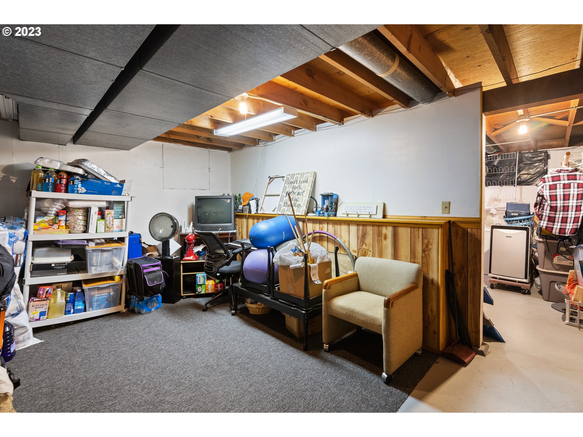 3832 North Kilpatrick Street Portland, OR 97217 - Photo 31 of 34 a living room with furniture and a flat screen tv