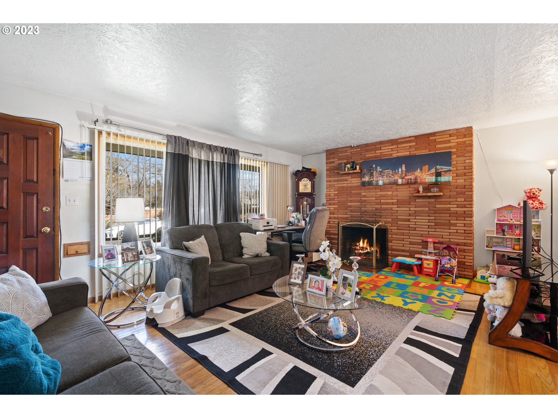 3832 North Kilpatrick Street Portland, OR 97217 - Photo 4 of 34 a living room with furniture and a fireplace