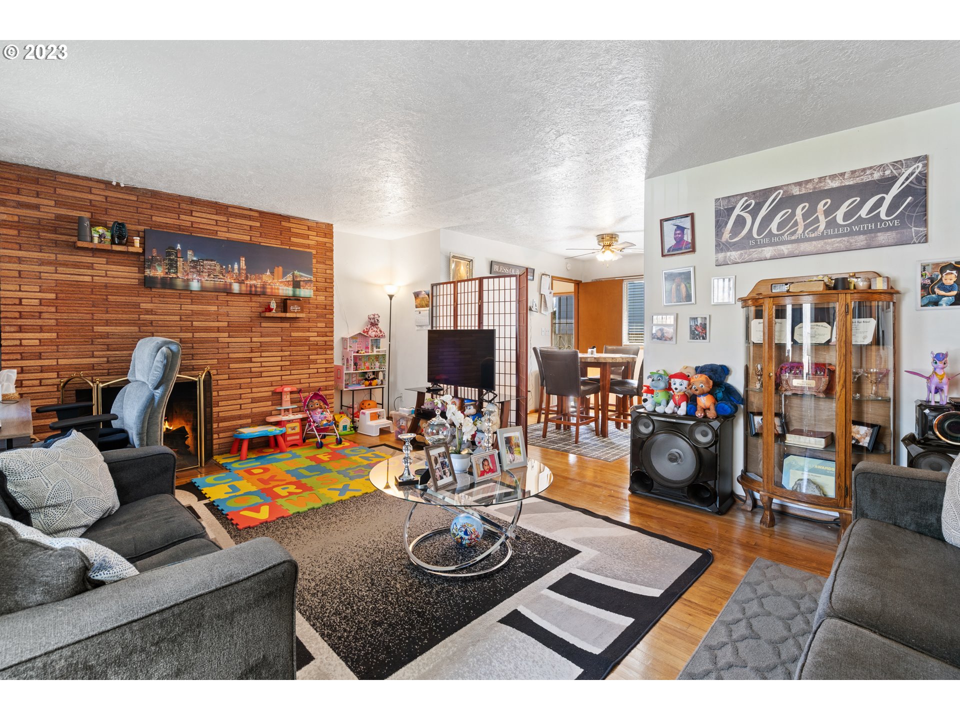 3832 North Kilpatrick Street Portland, OR 97217 - Photo 5 of 34 a living room with furniture and a flat screen tv
