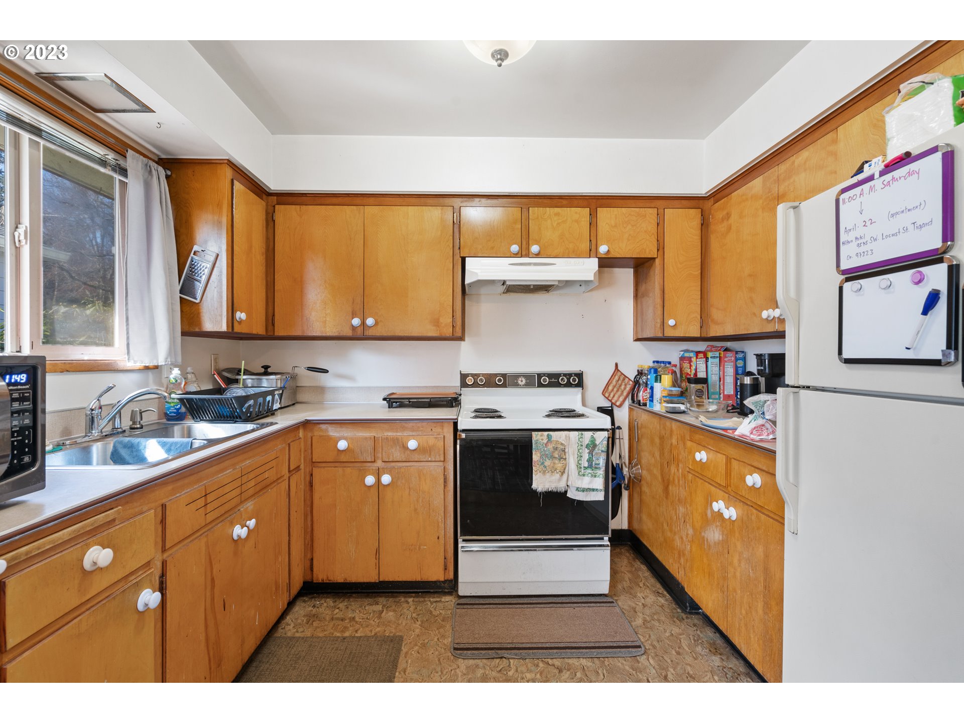 3832 North Kilpatrick Street Portland, OR 97217 - Photo 7 of 34 a kitchen with stainless steel appliances granite countertop a stove a sink and a refrigerator