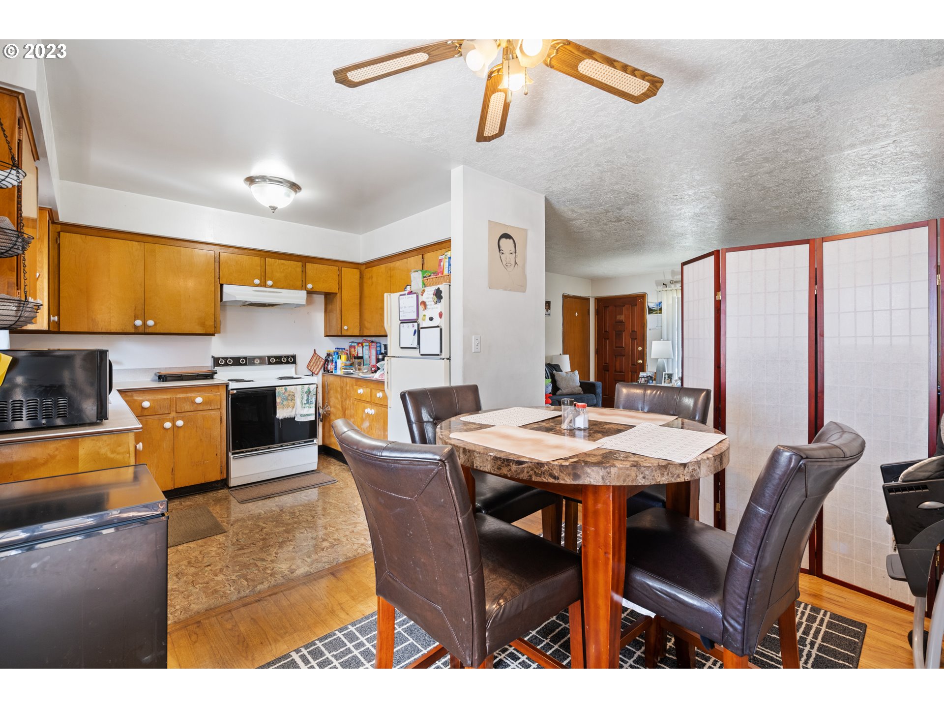3832 North Kilpatrick Street Portland, OR 97217 - Photo 9 of 34 a view of a dining room with furniture