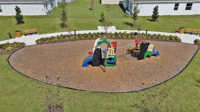 an aerial view of a house with outdoor space patio and outdoor seating