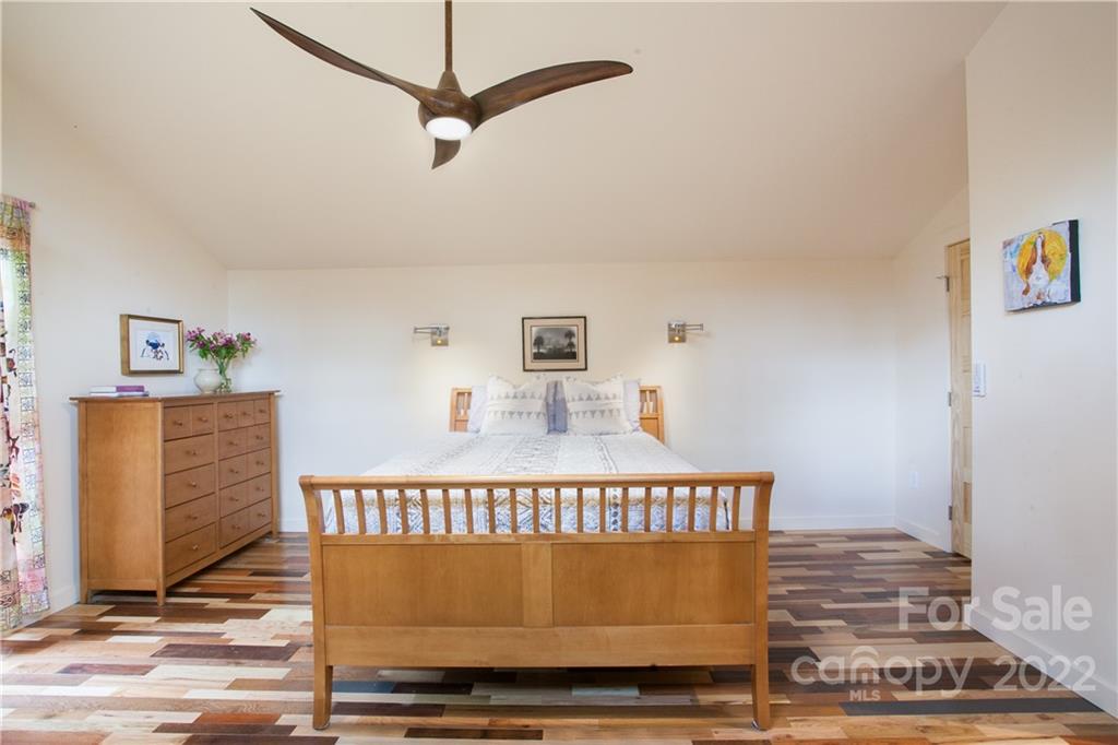 450 Lakey Gap Road Black Mountain, NC 28711 - Photo 20 of 40 a view of a bedroom with wooden floor