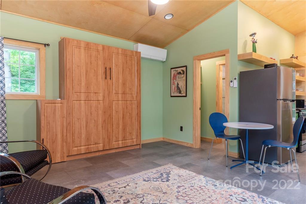 450 Lakey Gap Road Black Mountain, NC 28711 - Photo 25 of 40 a view of a room with furniture and air conditioner