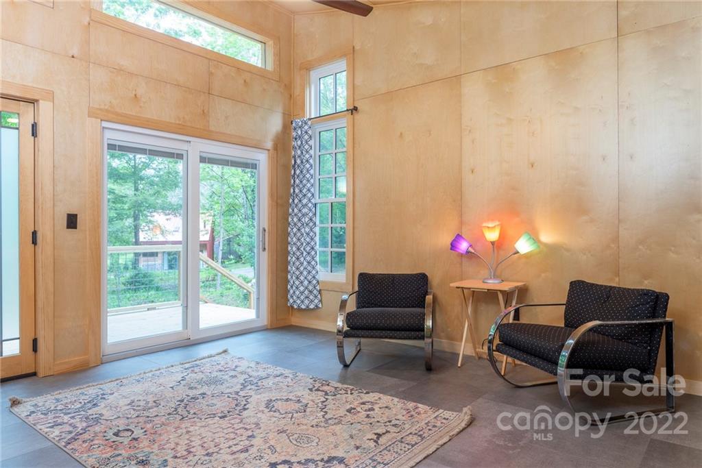 450 Lakey Gap Road Black Mountain, NC 28711 - Photo 26 of 40 a living room with furniture and a potted plant