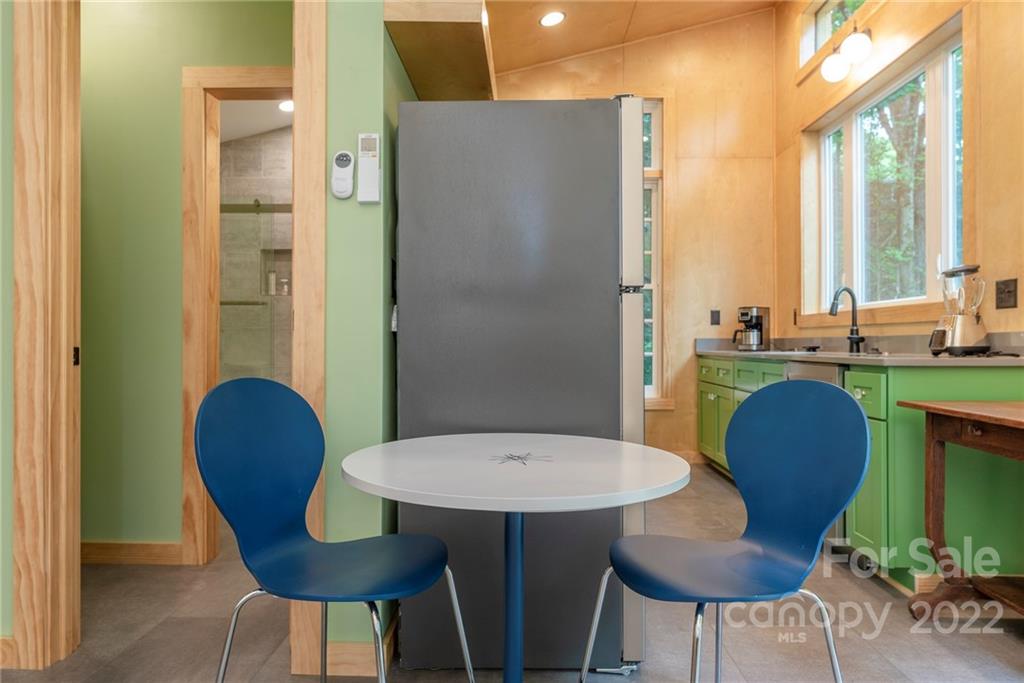 450 Lakey Gap Road Black Mountain, NC 28711 - Photo 27 of 40 a view of a dining room with furniture and window