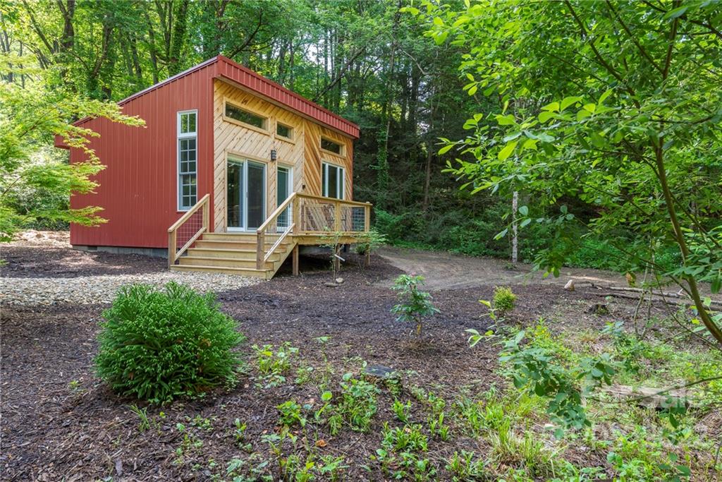 450 Lakey Gap Road Black Mountain, NC 28711 - Photo 3 of 40 a front view of a house with garden