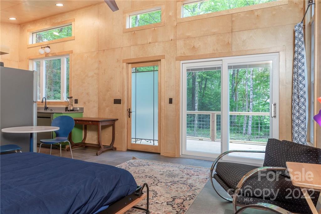 450 Lakey Gap Road Black Mountain, NC 28711 - Photo 31 of 40 a bedroom with furniture and a window