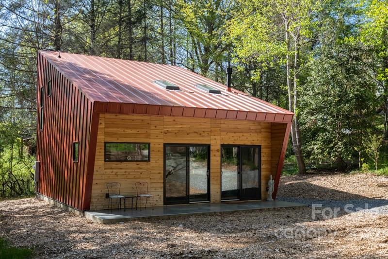 450 Lakey Gap Road Black Mountain, NC 28711 - Photo 39 of 40 a front view of a house with garden