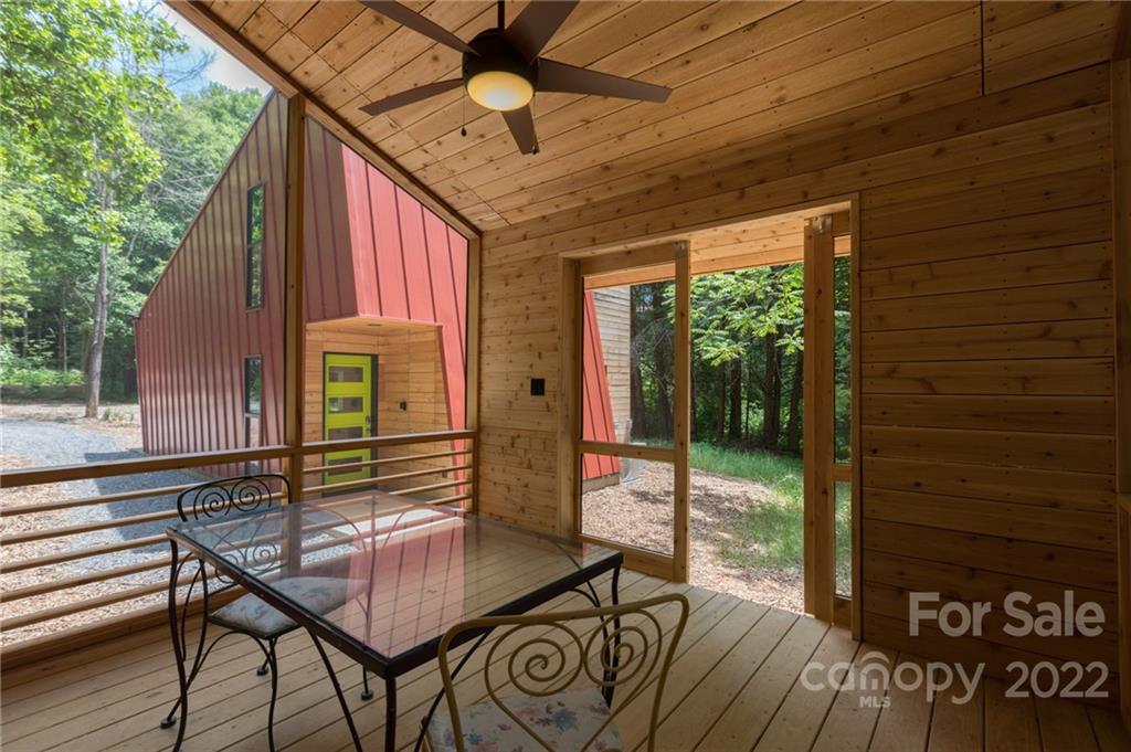 450 Lakey Gap Road Black Mountain, NC 28711 - Photo 6 of 40 a view of a patio with a table and chairs