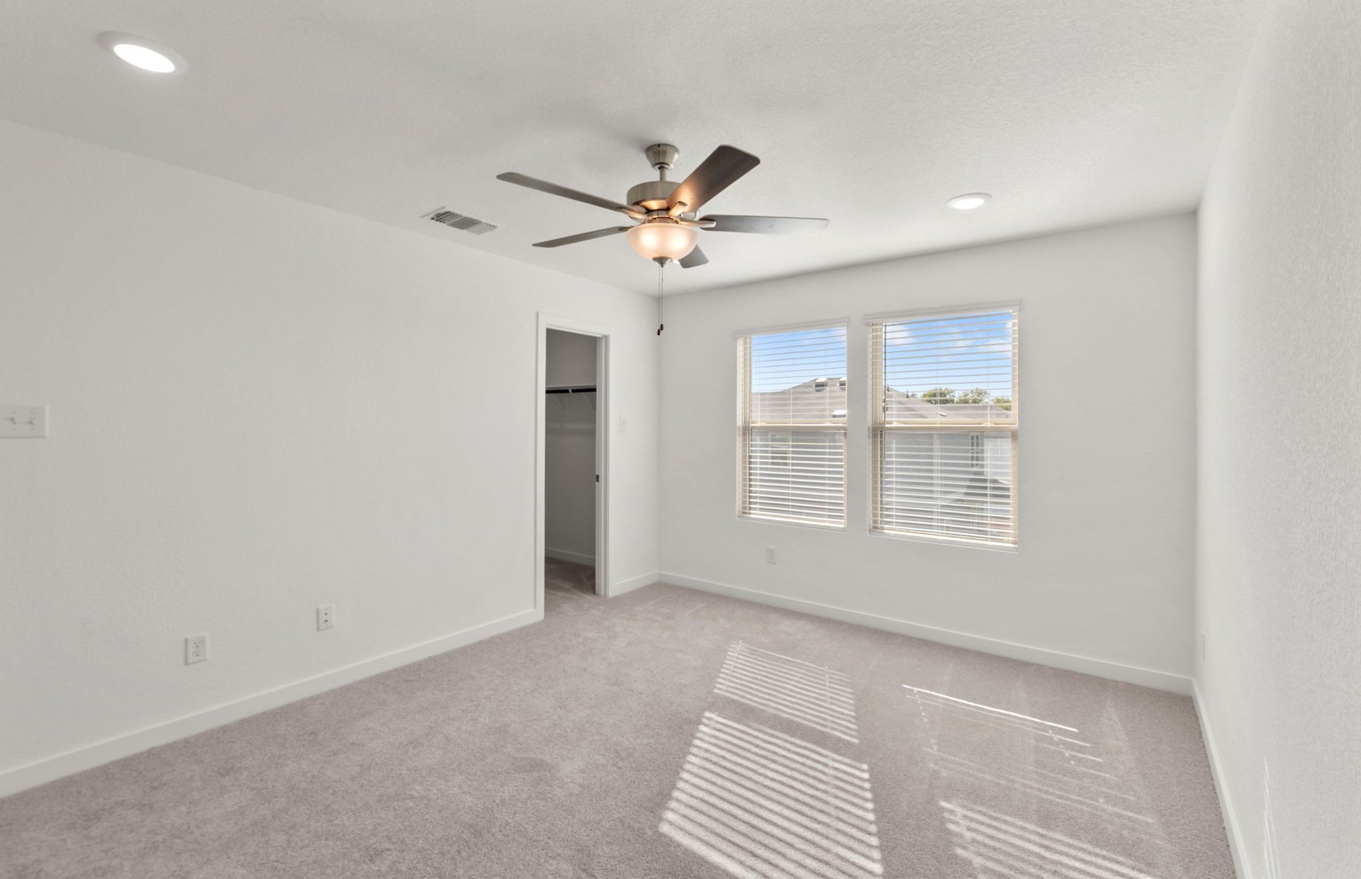 590 Rubber Tree Way Buda, TX 78610 - Photo 10 of 22 a view of an empty room with a window
