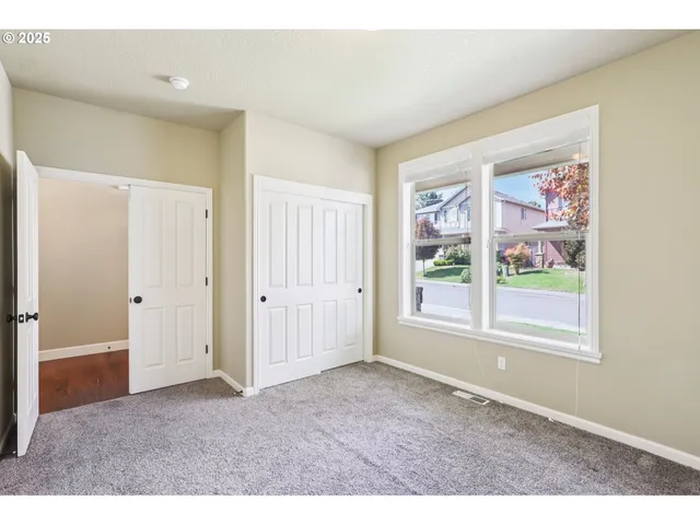 a big room with windows and closet