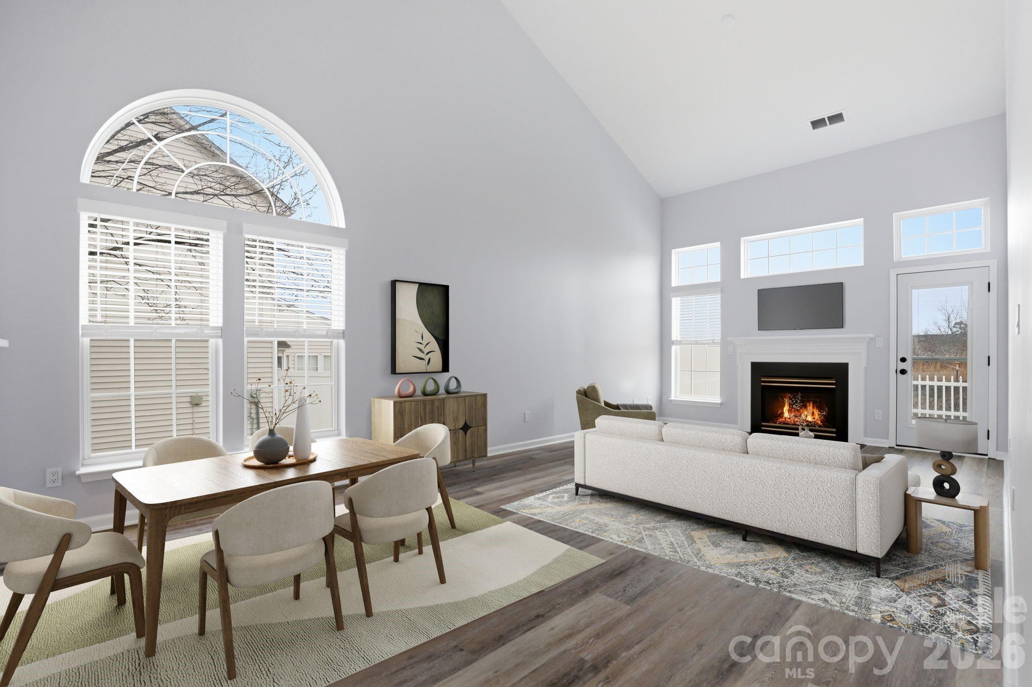 7978 Mariners Pointe Circle Denver, NC 28037 - Photo 11 of 37 a living room with furniture a fireplace and a table