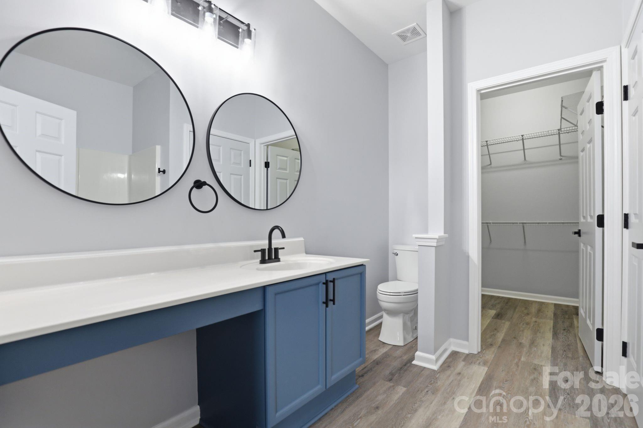 7978 Mariners Pointe Circle Denver, NC 28037 - Photo 16 of 37 a bathroom with a toilet a sink and mirror